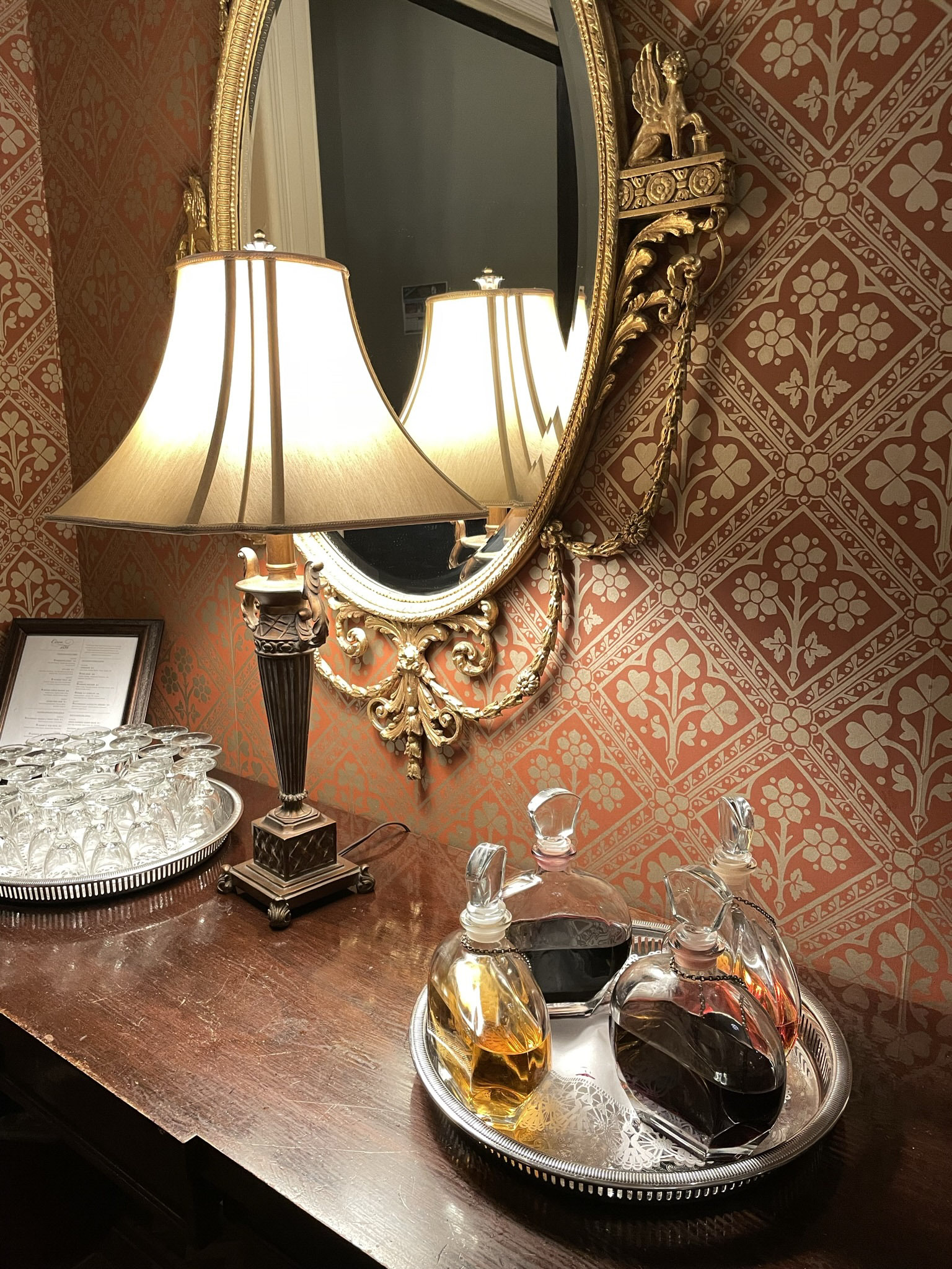 a platter with crystal bottles of sherry